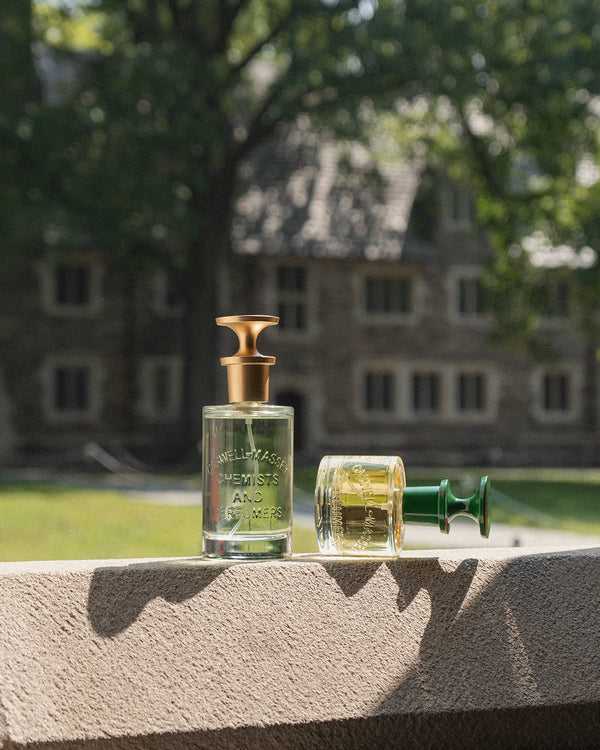 a bottle of perfume next to a bottle of perfume