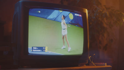 Caswell-Massey Video of professional tennis match intermixed with fragrance bottles on tennis court